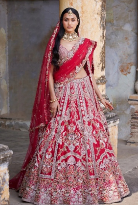 Hand-embroidered custom lehenga fabric detailing at Apreksha Design House atelier